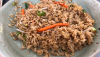 a plate of rice with vegetables