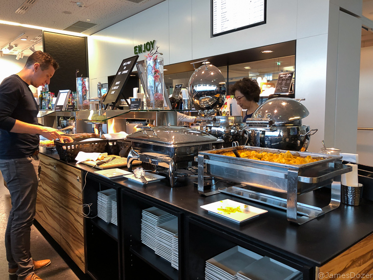 a buffet line with food on it