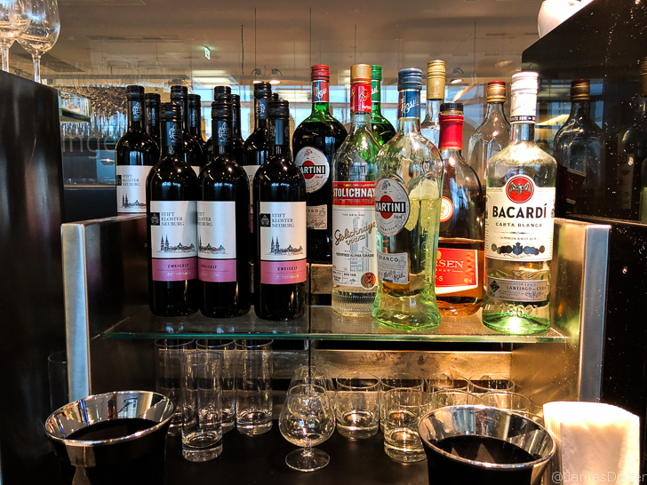a group of bottles of alcohol on a shelf