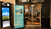 a glass door with a sign in front of it