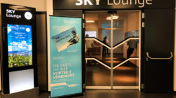 a glass door with a sign in front of it