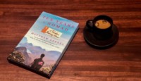 a book and a cup of coffee