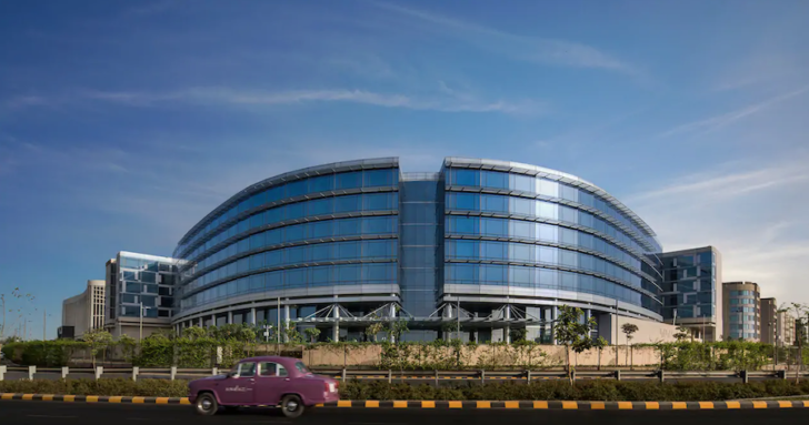 a car driving past a building