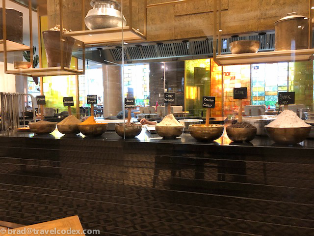 a row of bowls of food in a restaurant