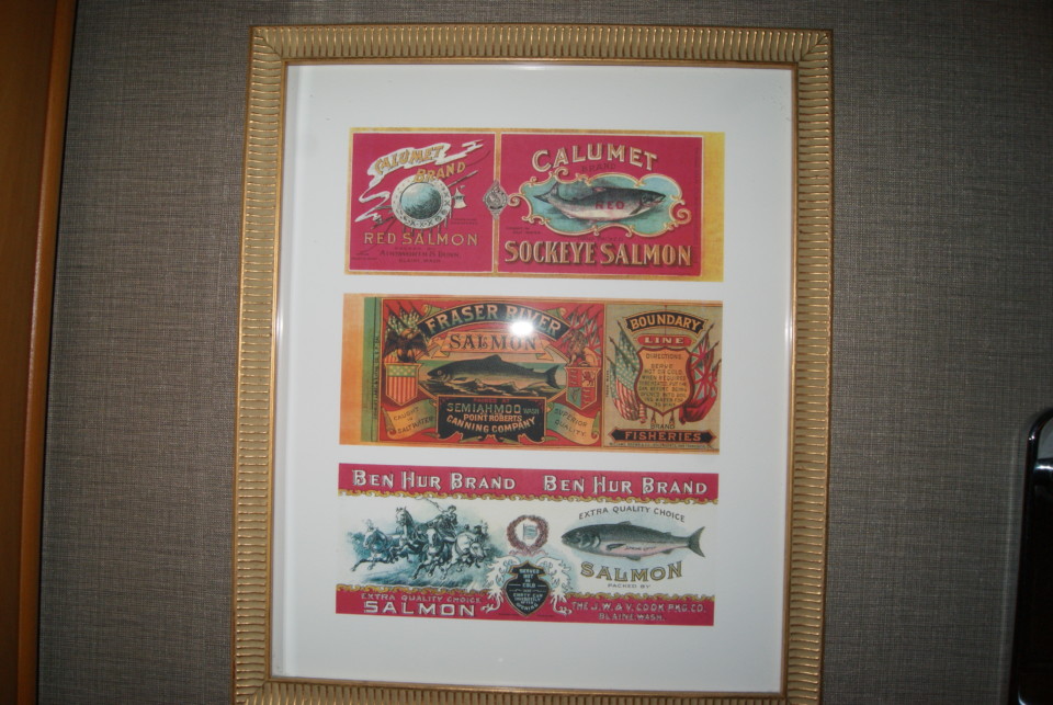a group of vintage labels in a frame