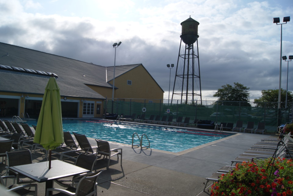 a swimming pool with a water tower