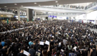 a large crowd of people in a large building