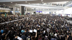 a large crowd of people in a large building