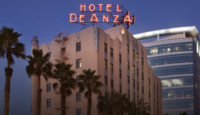 a hotel sign on top of a building