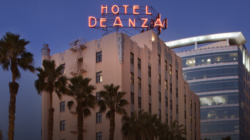 a hotel sign on top of a building