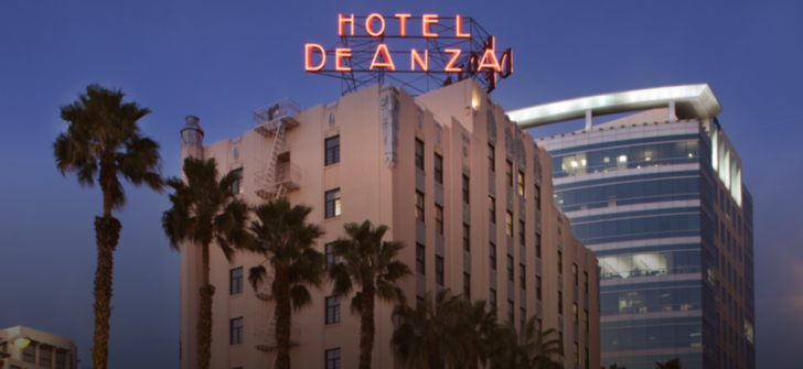 a hotel sign on top of a building