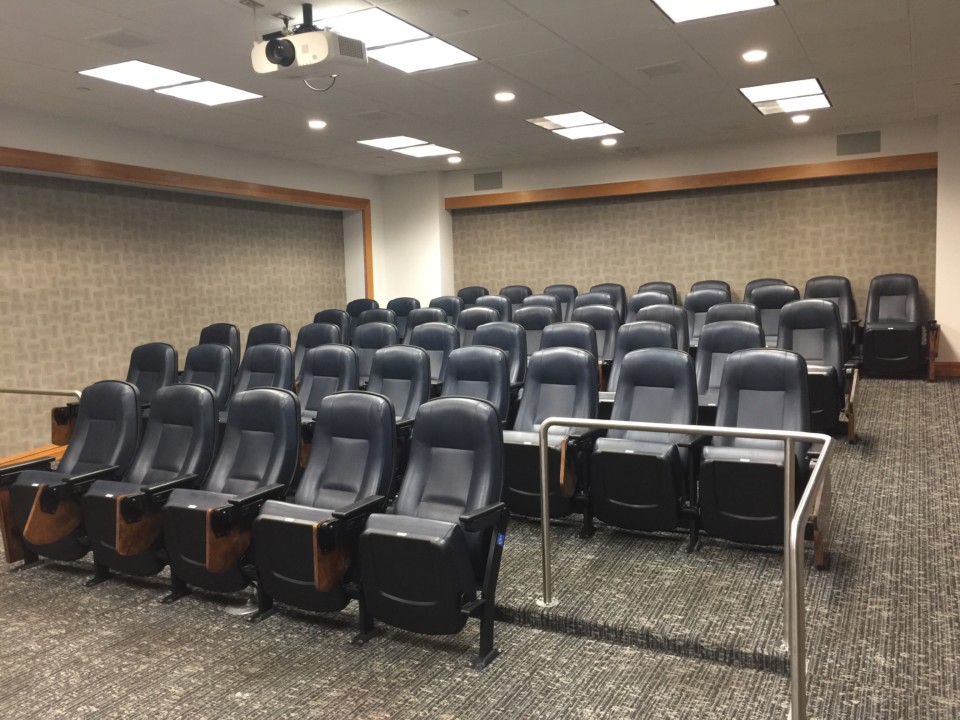 a room with rows of chairs