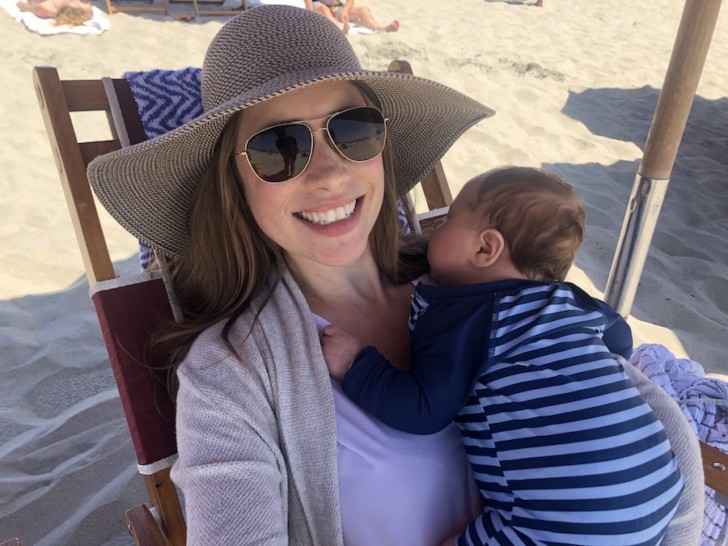 a woman holding a baby
