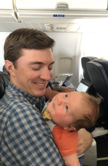 a man holding a baby