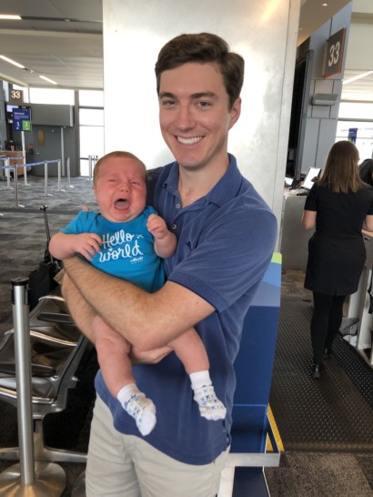 a man holding a crying baby
