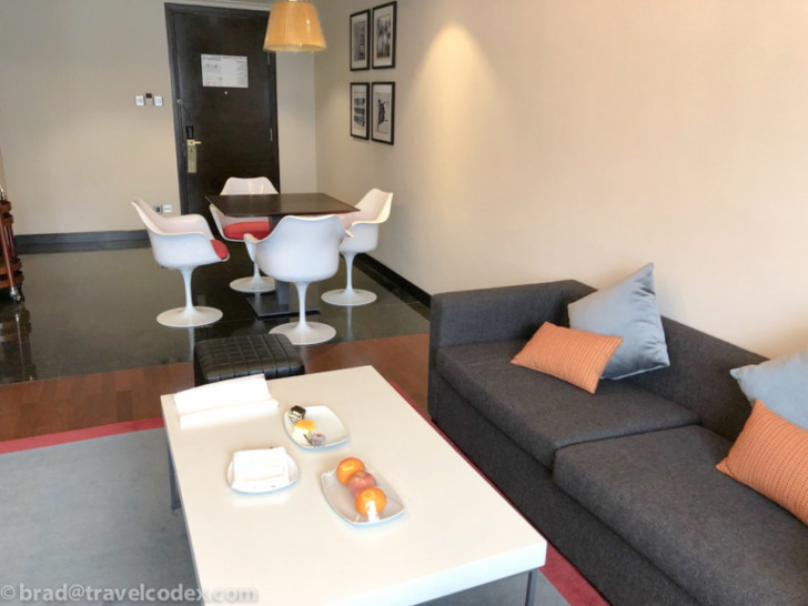 a living room with a couch and table