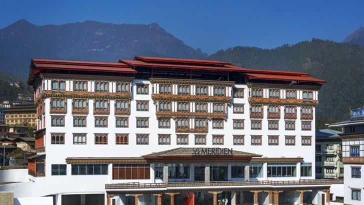 a large white building with red roofs
