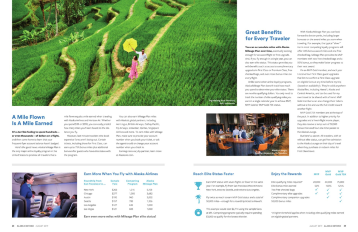 a magazine with a couple of people walking on a green field