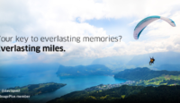 a person paragliding over a lake