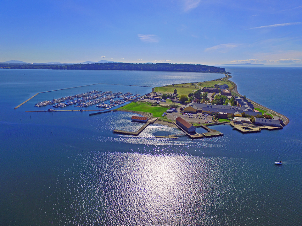 an island with boats and buildings on it