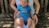 a woman holding a baby
