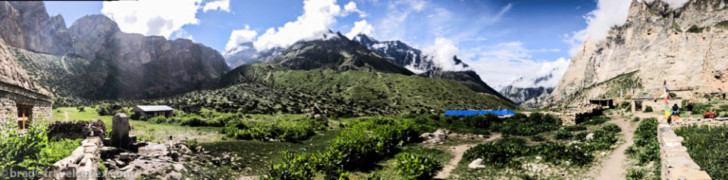 a mountain range with a blue roof