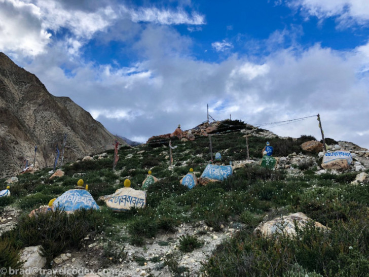 a group of painted rocks on a hill