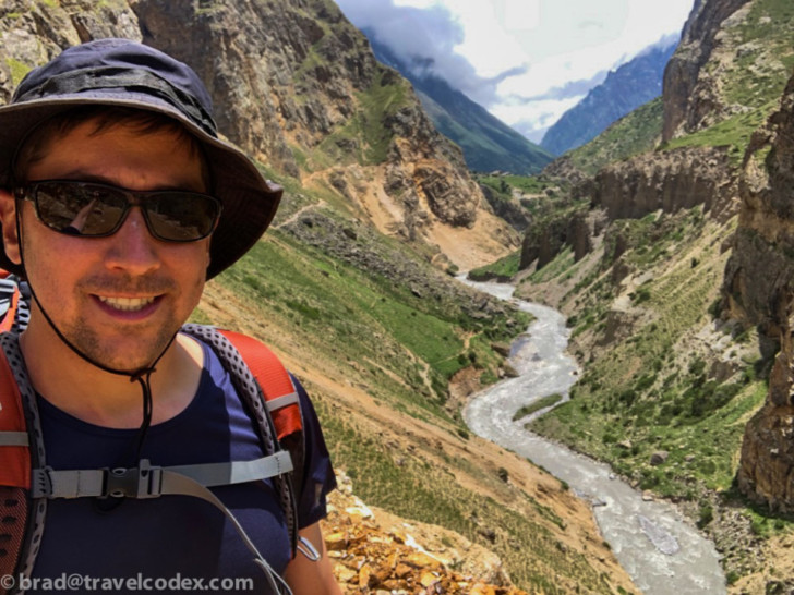 a man taking a selfie in a valley