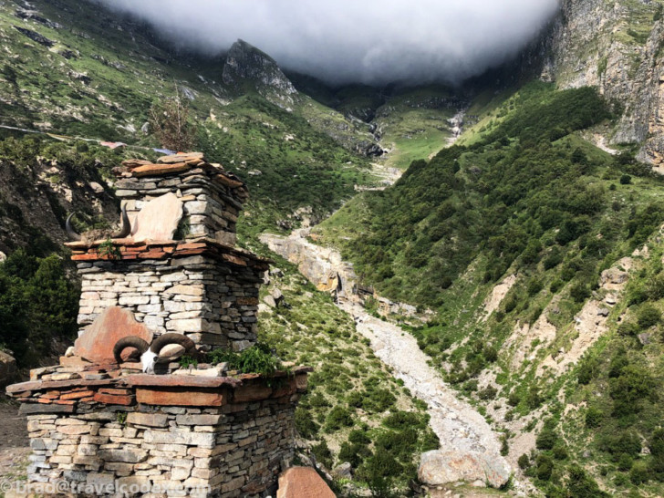 a stone chimney in a valley