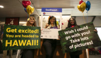 a group of women holding signs