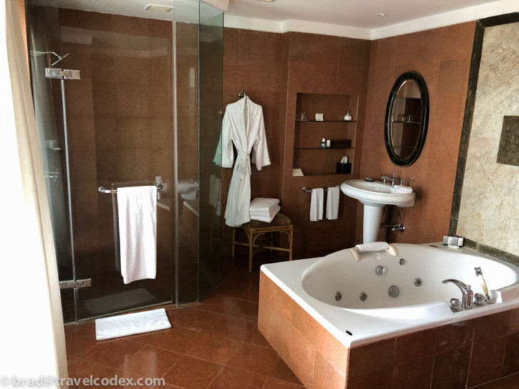 a bathroom with a bathtub and shower