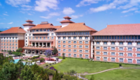 a large building with a lawn