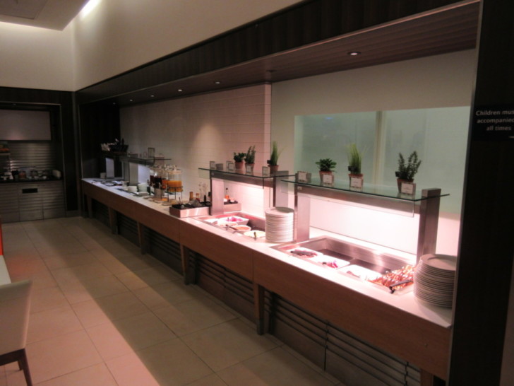 a buffet line with food on the counter