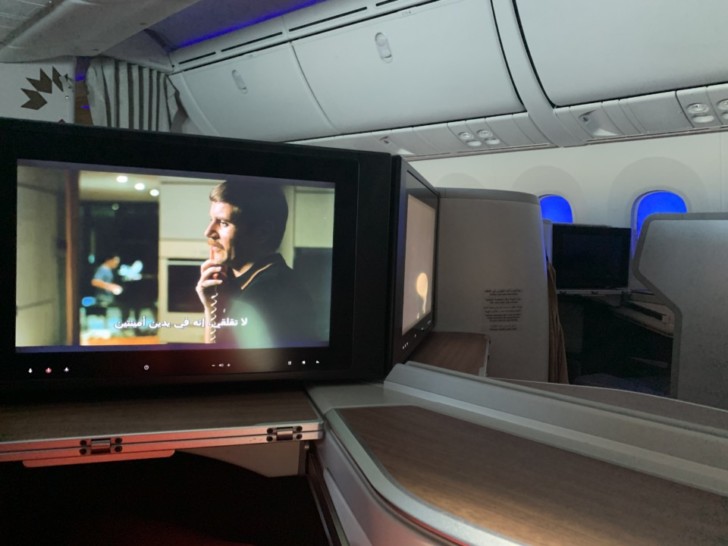 a tv on a table in an airplane