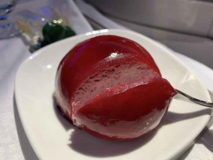 a red dessert on a white plate