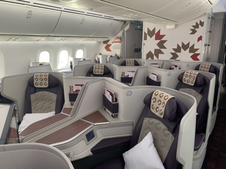 a plane with seats and a pillow