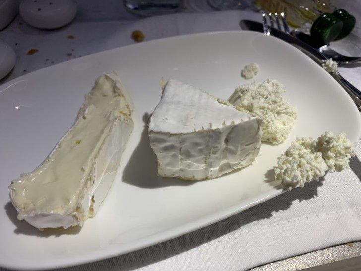 a plate of cheese on a table
