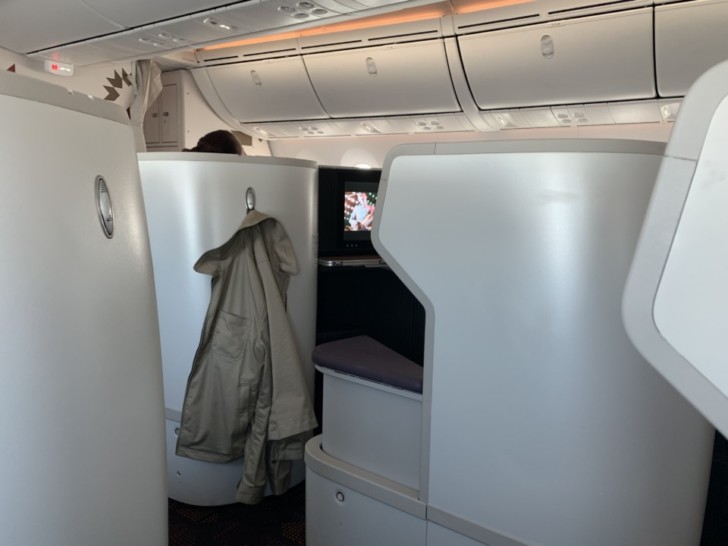 a room with a tv and a coat on it