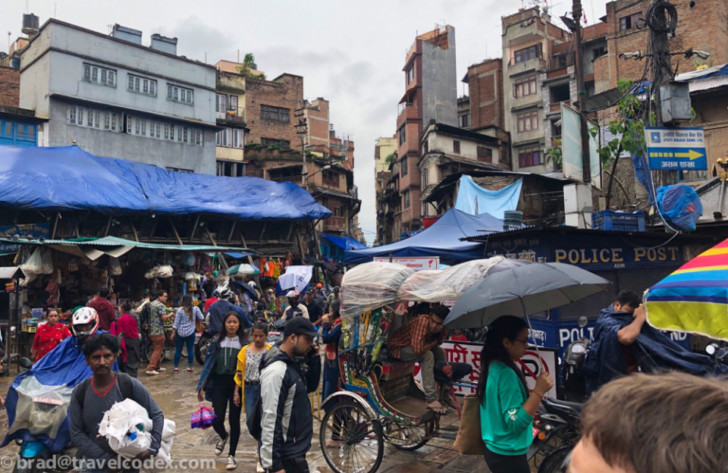 a group of people walking in a crowded city