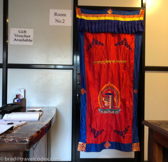 a red and blue curtain on a door