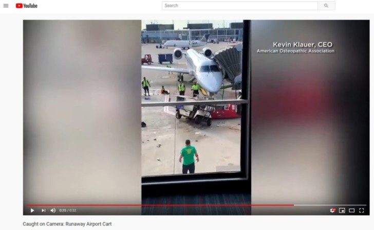 a man standing in front of an airplane