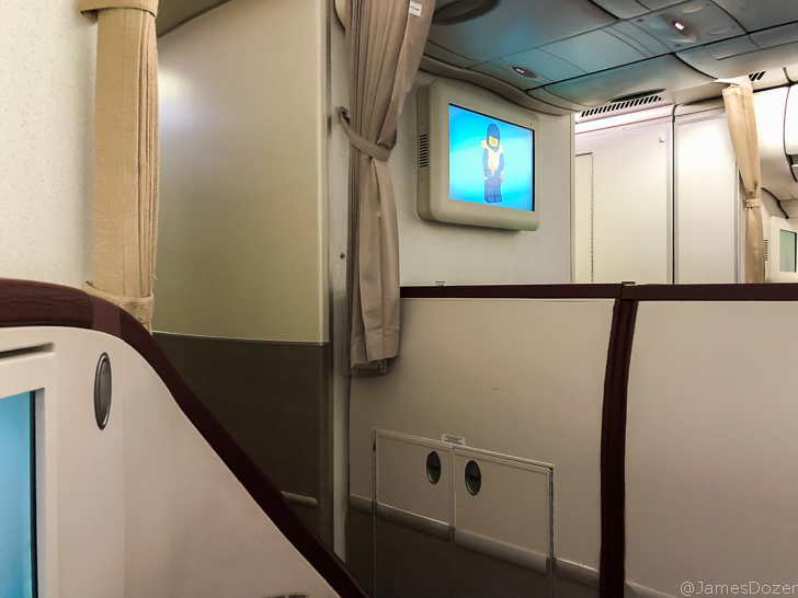 a tv on the wall of an airplane