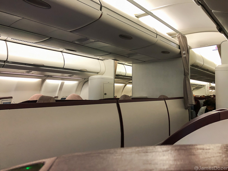 a white and brown seats on an airplane