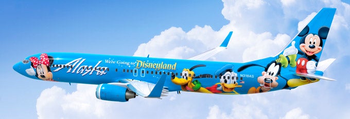 a blue airplane with cartoon characters on it
