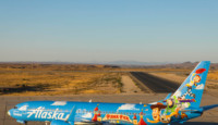 a blue airplane with cartoon characters on it
