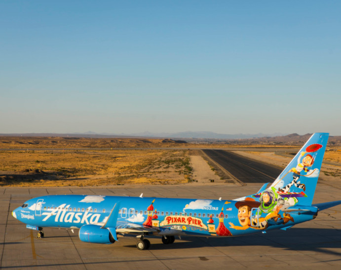 a blue airplane with cartoon characters on it