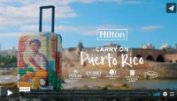 a suitcase with a painting on it