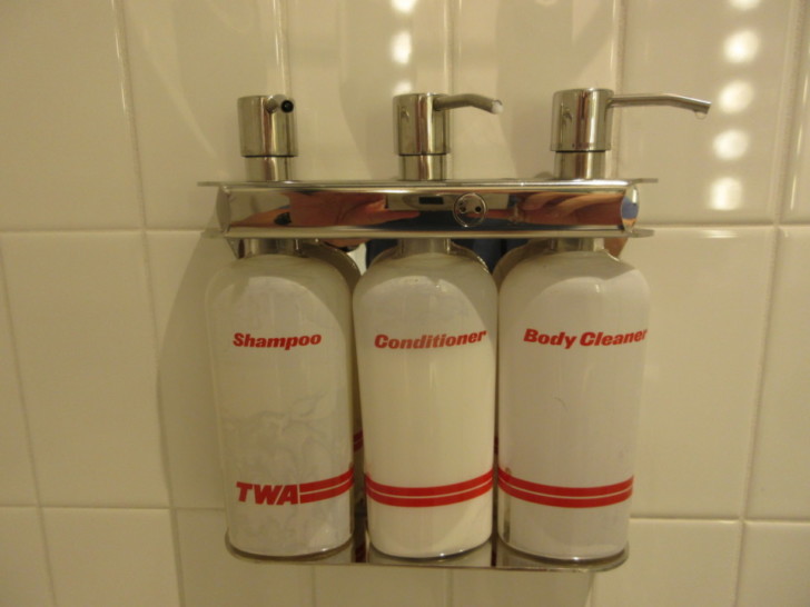 a group of shampoo bottles on a wall