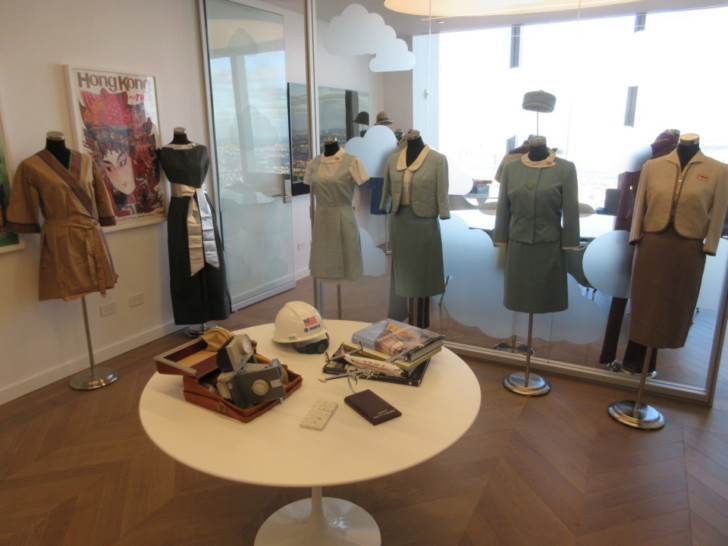 a room with mannequins and dresses