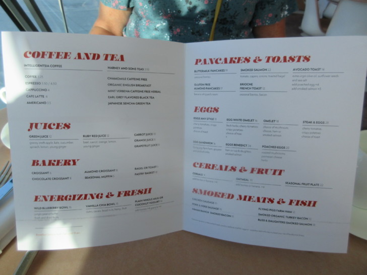 a person holding a menu